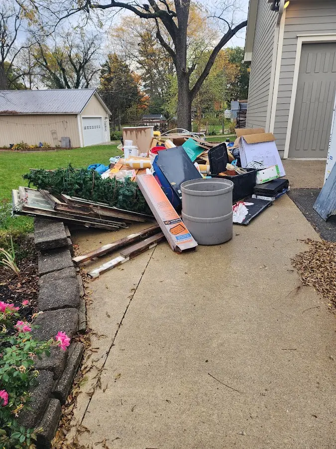 Dumpster being loaded with debris for Demolition Dumpster Rental in Doylestown